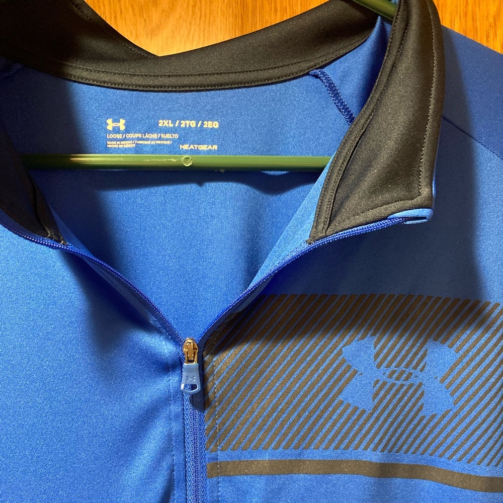 Men’s Blue Under Armour quarter zip. Very good condition.